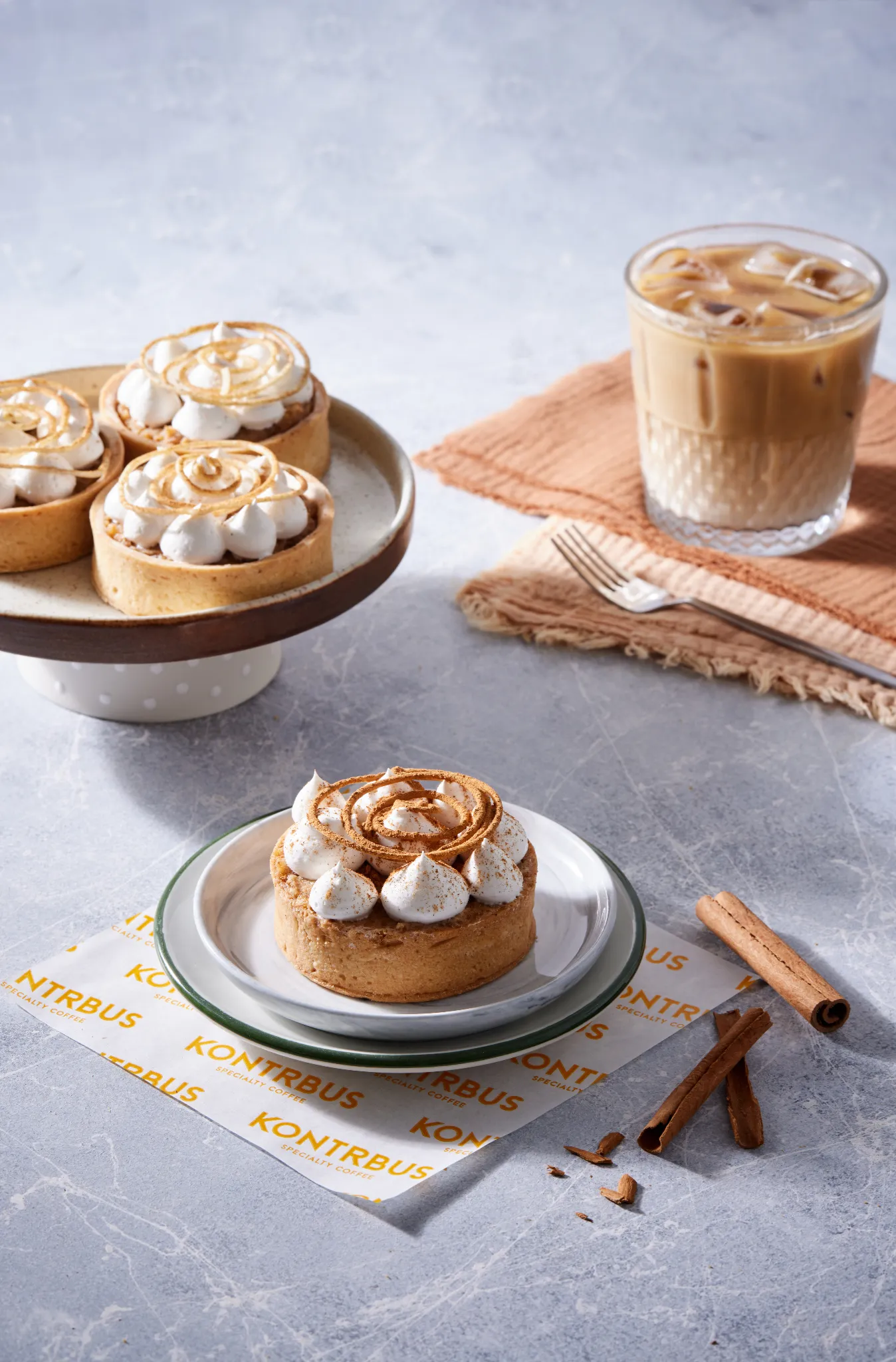Food styling in Atlanta — cinnamon cream tartlets with iced latte on cool stone