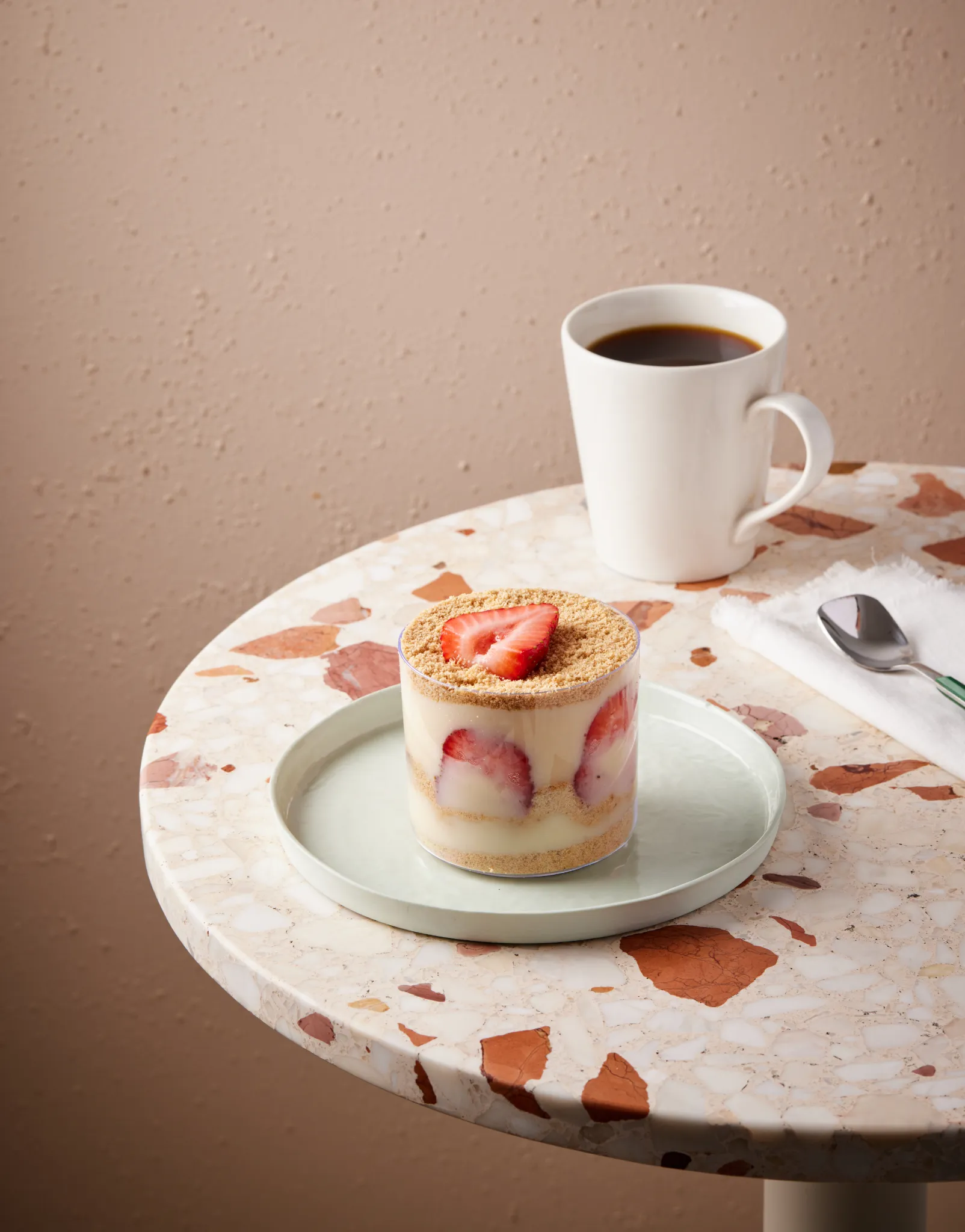 Atlanta food styling — strawberry trifle on terrazzo café table