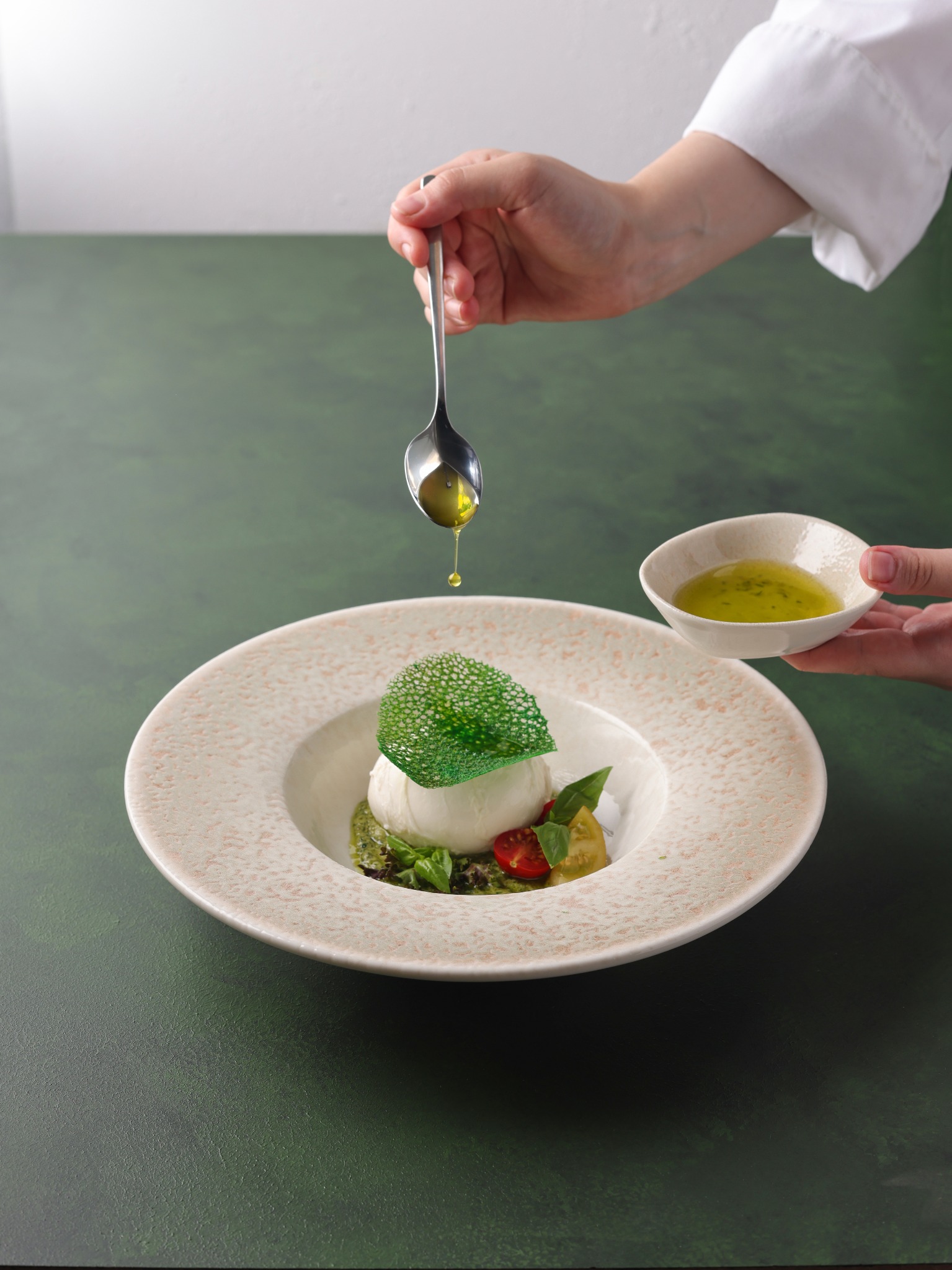 Burrata with basil pesto and green tuille garnish – studio food photography Atlanta.