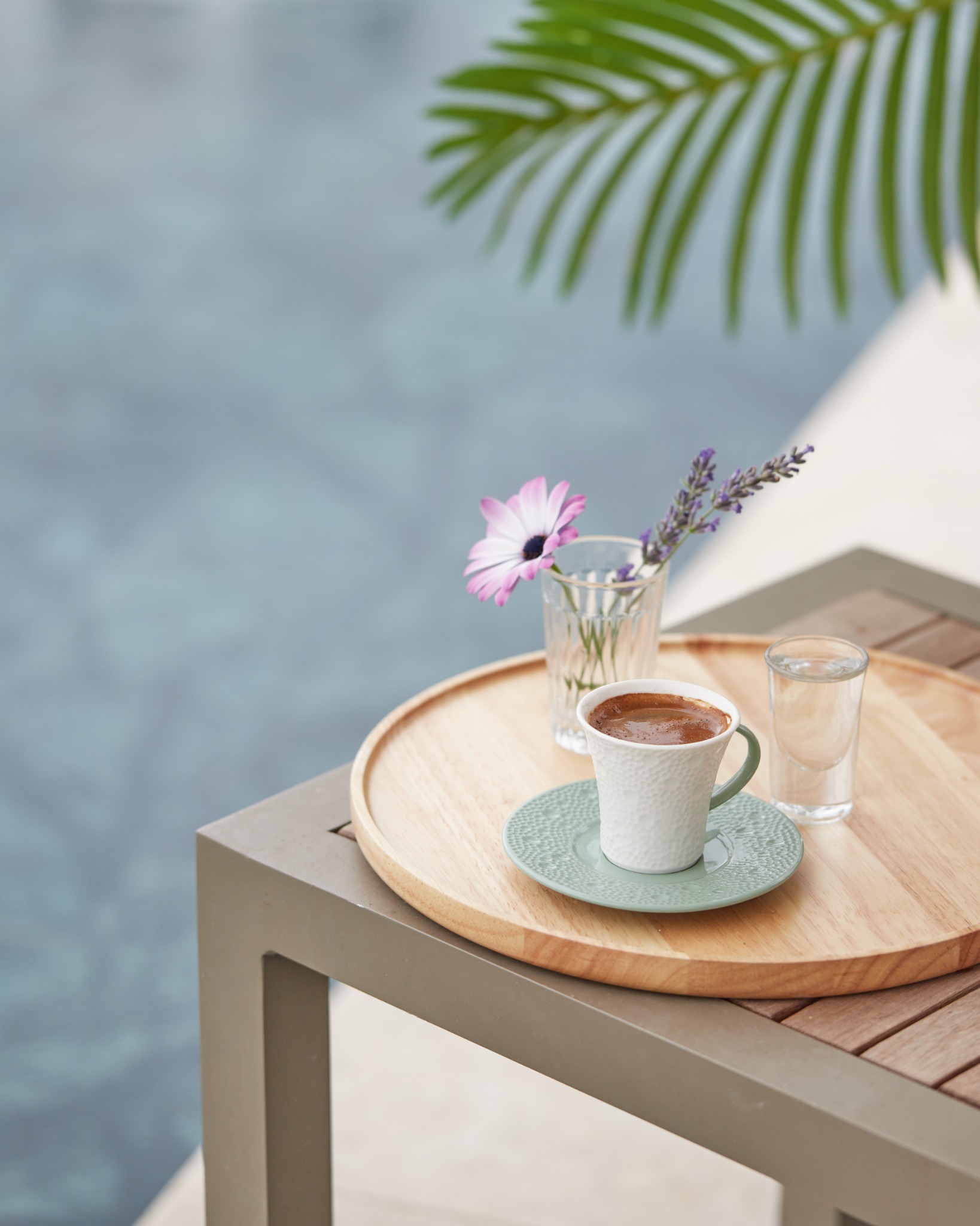 Turkish coffee on wooden tray with flowers by poolside – Sandy Springs beverage photography.
